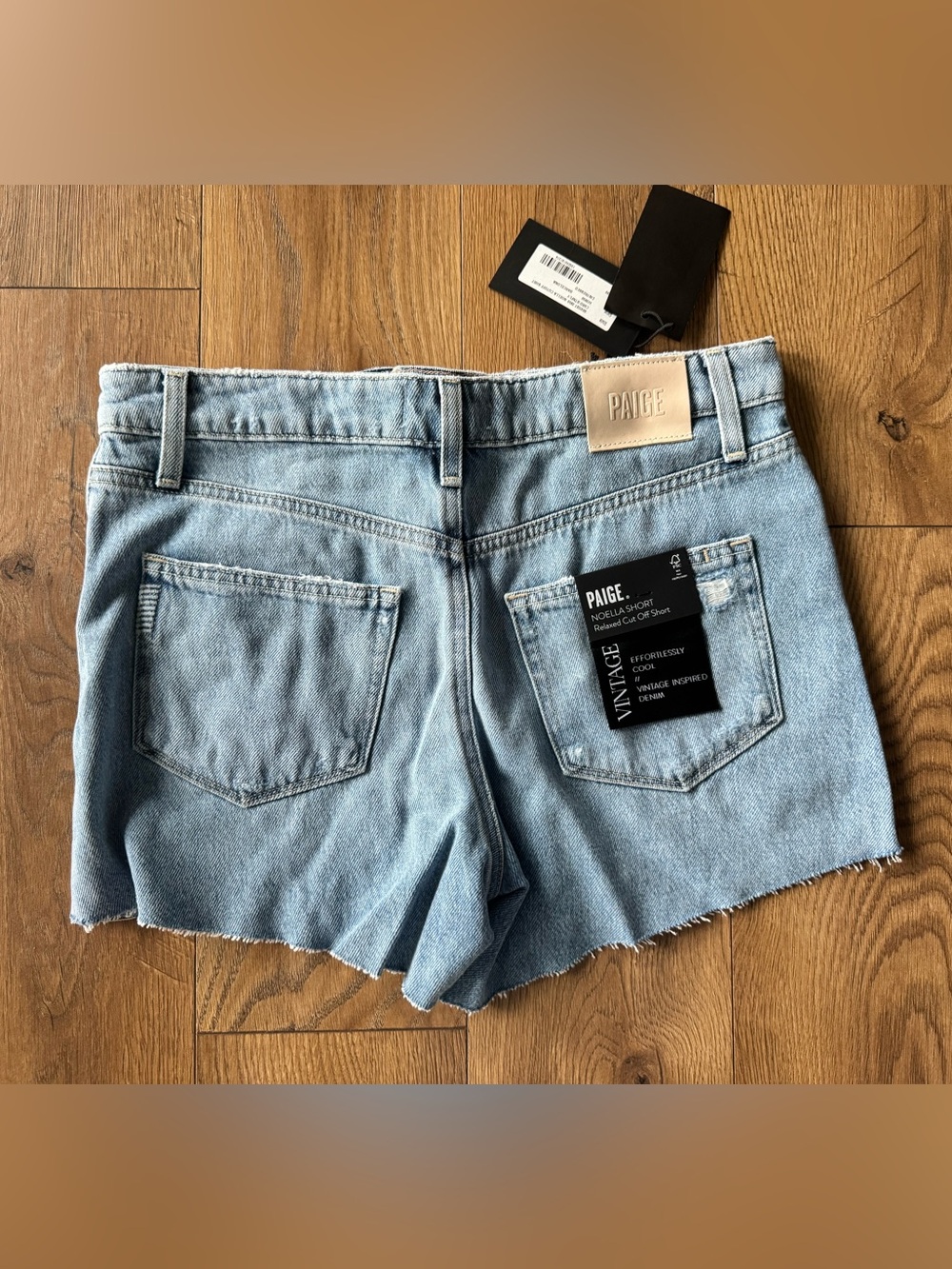 PAIGE Light Blue Denim Shorts with Frayed Hem